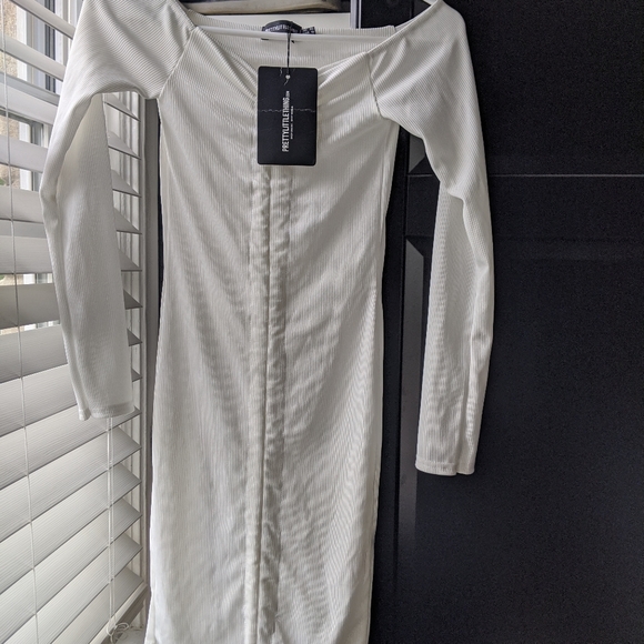 white ribbed long sleeve ruched bodycon dress